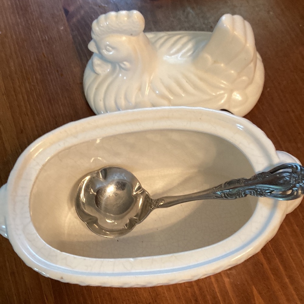 Hen  gravy bowl A place for a spoon goes in hole on side Bowl is 3 inches deep